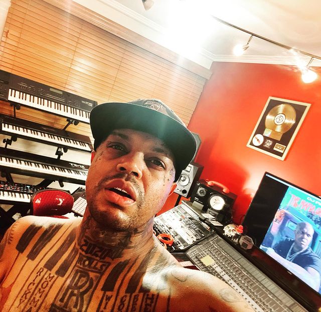 shirtless selfie of dj paul in his studio wearing a cap